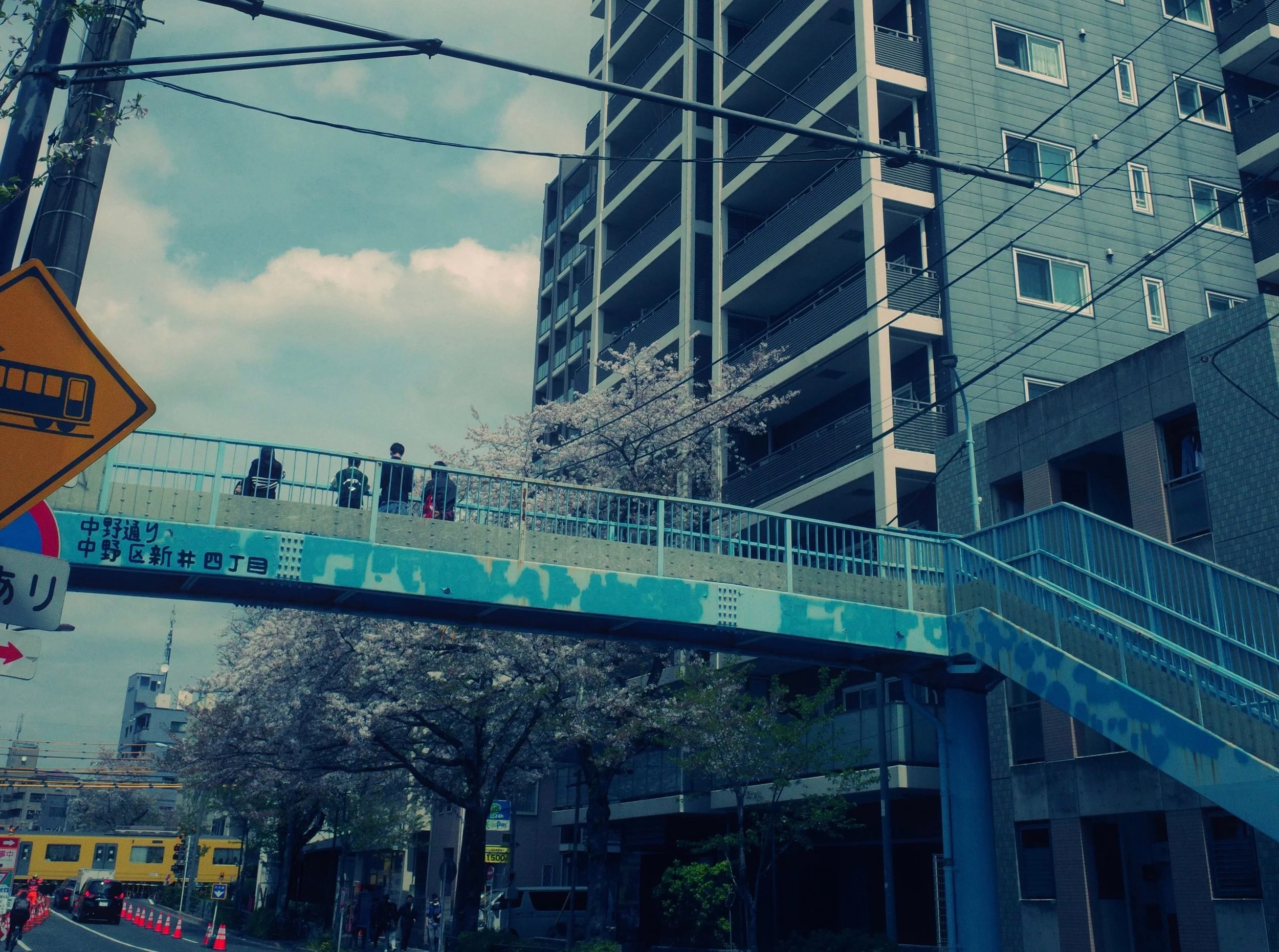 Photographers waiting for the yellow train in Nakano.